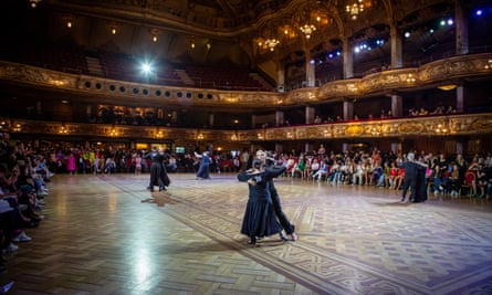 A ballroom dancing competition in a grand ballroom.