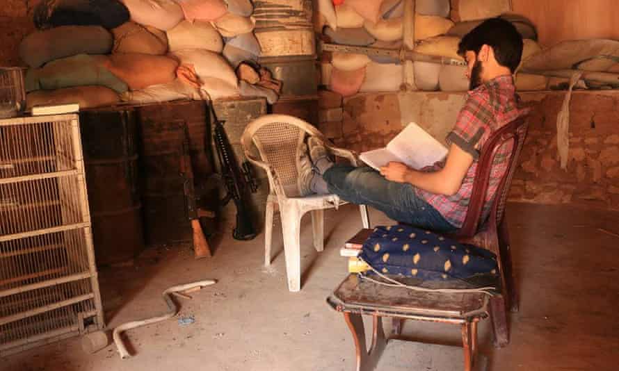 Omar Abu Anas reading on the frontline
