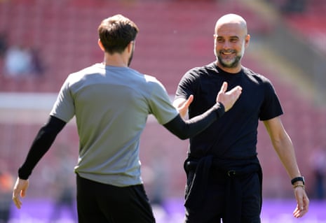 Manchester City manager Pep Guardiola (right) greets Southampton player and assistant manager Adam Lallana at St Mary's Stadium.