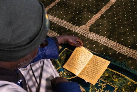 top down view of a man reading a Quran