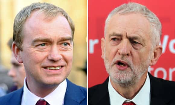 Tim Farron (left) has accused Jeremy Corbyn's Labour party of giving up the fight.