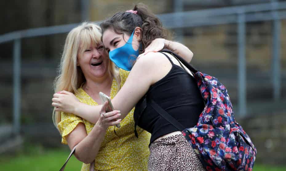 A student reacts after receiving her A-level results at Crossley Heath grammar school in Halifax