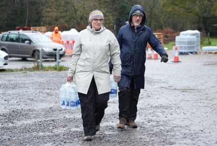 People collect bottled water from a car park in Tunbridge Wells.