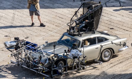 Daniel Craig is partially seen sitting inside one of the Aston Martin DB5s used on the set of No Time to Die in Matera, southern Italy.