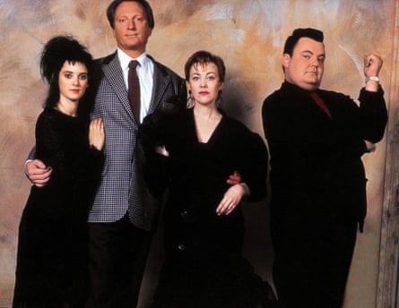 four people pose for a portrait