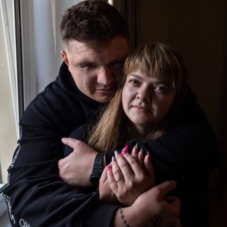 Veres stands behind Lysachenko with him arms wrapped around her