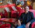 Ray Blanchette sits on red banquette in a restaurant in Leeds