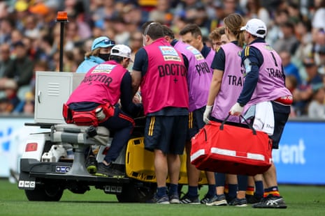 A player leaves the field with concussion during an AFL match in April