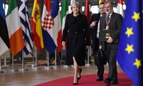 Theresa May and UK permanent representative to the EU Tim Barrow arrive at the European union summit in Brussels, 14 December 2017.