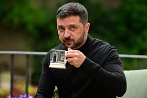 Ukraine’s president, Volodymyr Zelenskyy, drinks tea from a mug with an image of 10 Downing Street’s front door on it