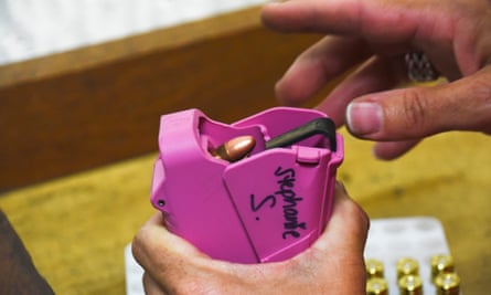 Stephanie Stockman, chapter leader of the Well Armed Woman, uses a speed loader to fill up a clip.