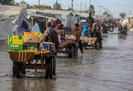 Khan Yunis on 15 November. Displaced Palestinians living in tents after their homes were destroyed by Israel’s attacks on the Gaza Strip are struggling to survive amid the pools of water formed by the rain.