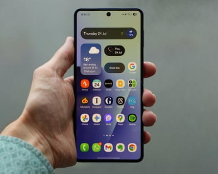 The Samsung Galaxy Z Flip 7 open in a hand showing the home screen.