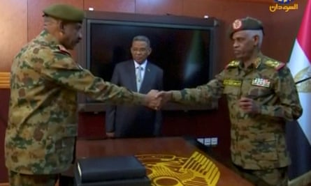 Ahmed Awad Ibn Auf and the Sudanese military’s chief of staff, Lt Gen Kamal Abdul Murof Al-mahi after being sworn as leaders of the military transitional council.