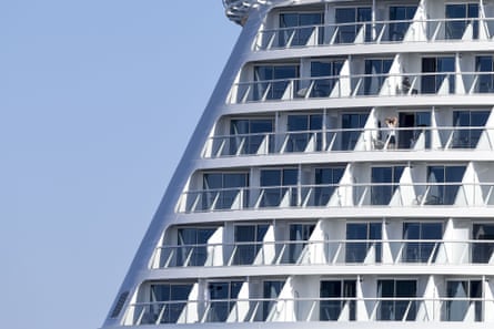 Crew on the balcony of the Celebrity Apex cruise ship, Saint-Nazaire, France, 1 April 2020