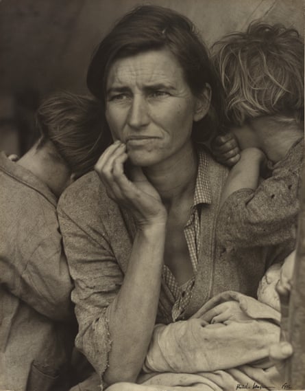 Black and white portrait of a young mother with two of her seven children