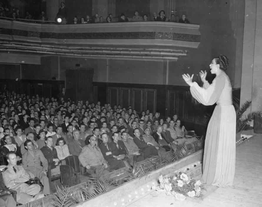 Josephine Baker performs on stage before an audience that includes a number of uniformed military personnel, Casablanca, Morocco, 1943.