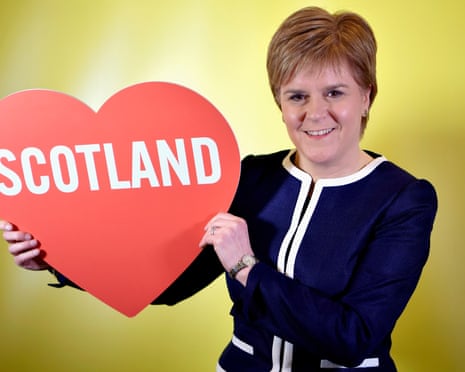 nicola sturgeon holding big red cardboard heart with scotland written in it