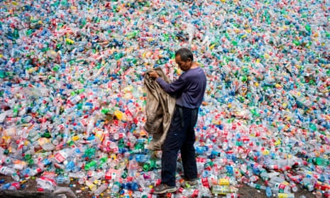 A Chinese labourer sorting out plastic bottles  on the outskirt of Beijing