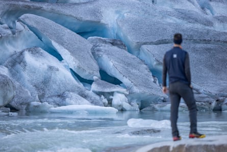 Matthias Huss looks at the ice on the Rhône glacier in Obergoms, Switzerland.