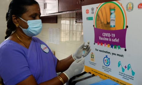 A health official prepares a vaccine kit as she takes part in trial run for Covid-19 vaccine delivery in Chennai