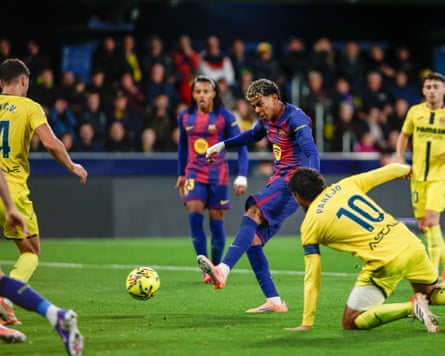 Lamine Yamal toe-pokes the ball into the Villarreal net to make it 2-0 to Barcelona.