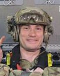 Capt George Lacey in helmet and uniform on the plane