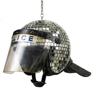 Disco ball made from used police riot helmets