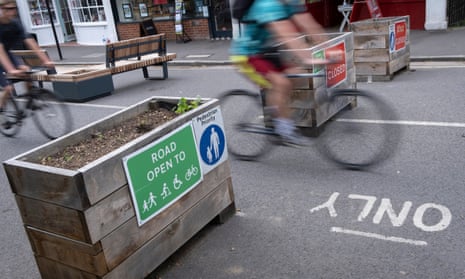 A cyclist passes through the barriers that form an LTN in the borough of Southwark