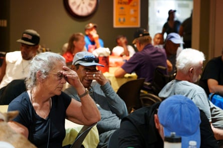 People take shelter from the heat at the Justa cooling center in Phoenix, Arizona, on 16 July 2023.