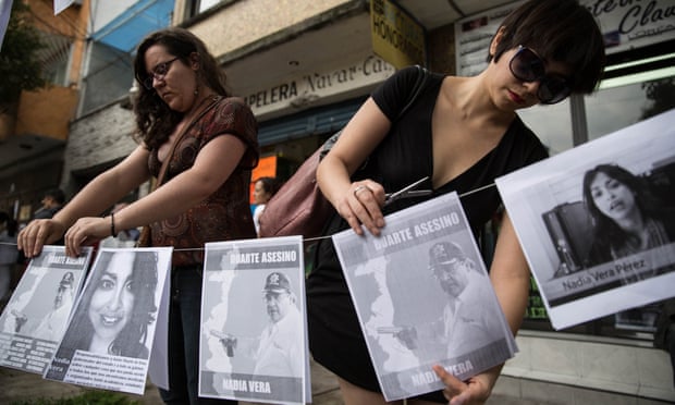 Women place portraits of the social activist Nadia Vera and Javier Duarte, the governor of Mexico’s Veracruz state, outside the apartment where she was murdered alongside Alejandra Negrete, Mile Virginia Martín, Yesenia Quiroz and Rubén Espinosa.