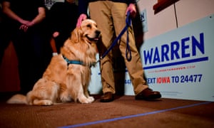 Elizabeth Warren’s husband, Bruce Mann, and golden retriever, Bailey Warren, greet supporters on 29 January 2020 in Fort Dodge, Iowa.