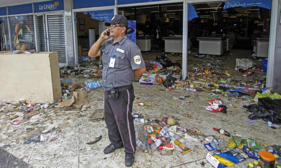 A security guard outside a supermarket after protests against the Nicaraguan government’s social security reforms, which have now been dropped.