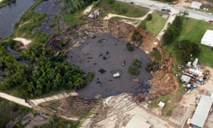 A large sinkhole swallowed up oil field equipment and vehicles in this southeastern Texan city