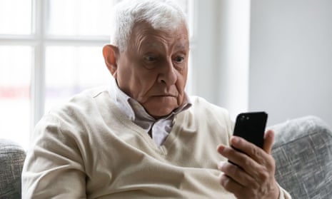 A man staring at a smartphone