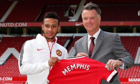 Memphis Depay is welcomed to Manchester United by Louis van Gaal in 2015.