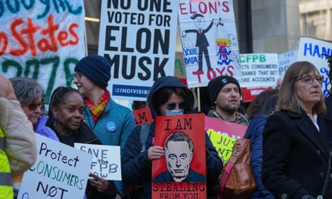 Demonstrators gather outside the Consumer Financial Protection Bureau to protest against Donald Trump's move to close it, Washington DC, 10 February 2025.