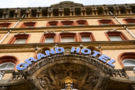 The front of the Grand hotel, with kittiwakes nesting above several of the window frames.