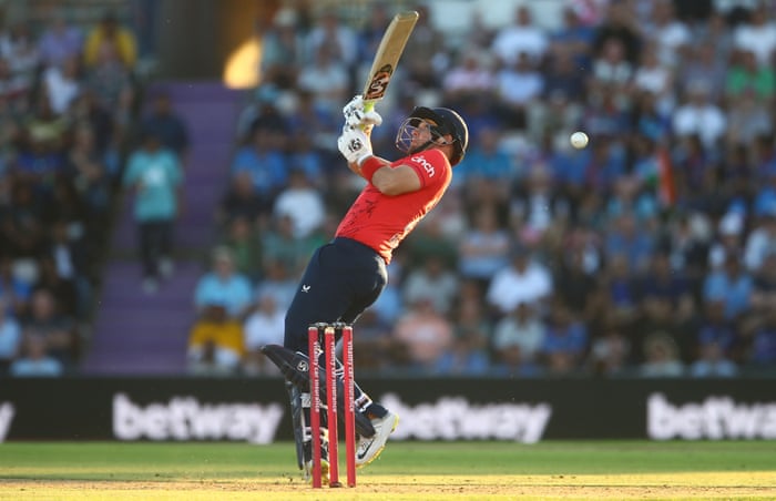 Liam Livingstone from England tries to push Hardik Pandya from India, but falls behind.