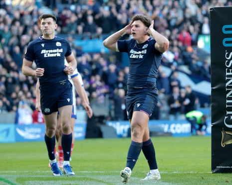 Tom Jordan of Scotland celebrates scoring his team's seventh try.