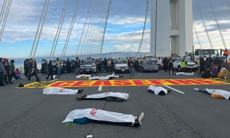 People take part in a protest in support of Palestinians in Gaza, amid the ongoing conflict between Israel and the Palestinian group Hamas, at Bay Bridge, in San Francisco, California, U.S., November 16, 2023 in this picture obtained from social media.