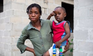 Royda Joseph, 32, who lives next to Dar es Salaam's main dump, and her son Victor.