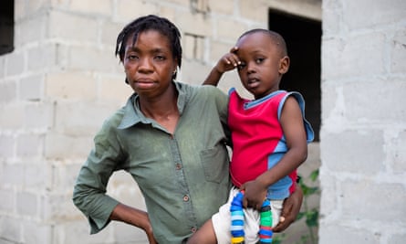Royda Joseph, 32, who lives next to Dar es Salaam’s main dump, and her son Victor.