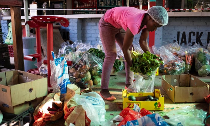 A member of staff packs food hampers for people in need at the Railways cafe, Pretoria, South Africa, on 4 June 2020. The cafe has begun feeding the homeless in the area as the coronavirus lockdown has forced thousands of homeless and less fortunate into begging for food.