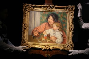 Gloved hands hold up a framed oil painting of a mother and child playing with toys