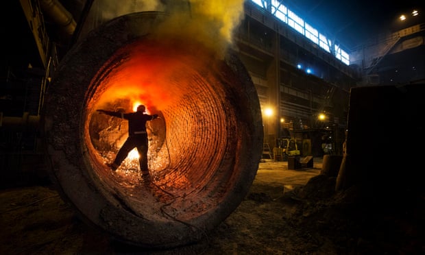 A worker carries out a burning procedure inside a ladle at Sheffield Forgemasters International
