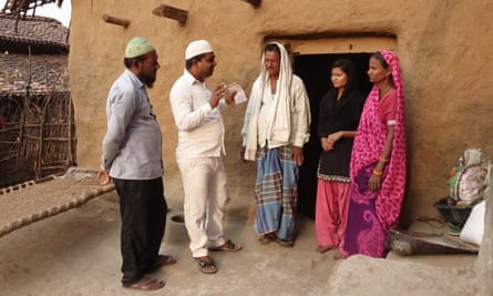 Members of the DRA meet Safik Ansari and his family in Neura village, Jharkand state