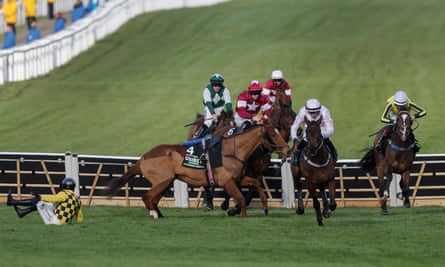 State Man falls at the final hurdle and hampers Brighterdaysahead as Golden Ace, second right, goes clear to win the Champion Hurdle.
