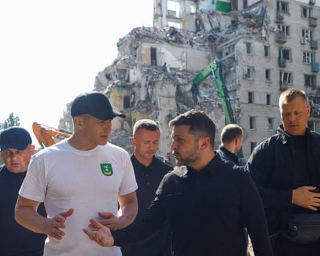 Ukraine's president Volodymyr Zelenskyy visits the site of an apartment building damaged during overnight Russian missile and drone strikes in Kyiv, Ukraine.