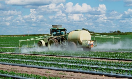 Field being sprayed with pesticide